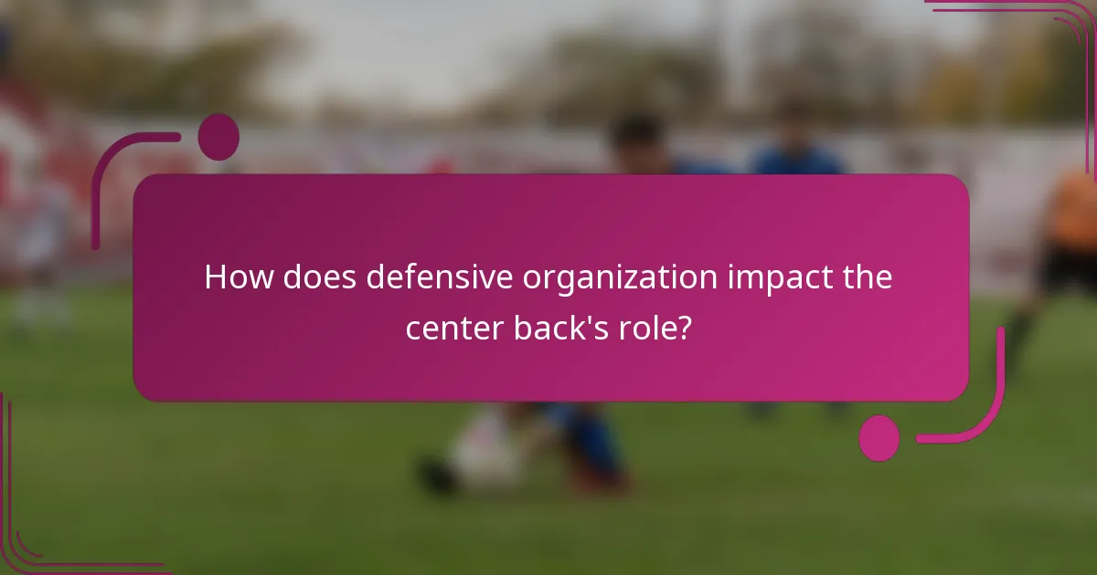 How does defensive organization impact the center back's role?