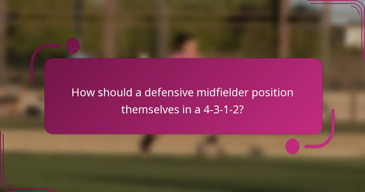 How should a defensive midfielder position themselves in a 4-3-1-2?